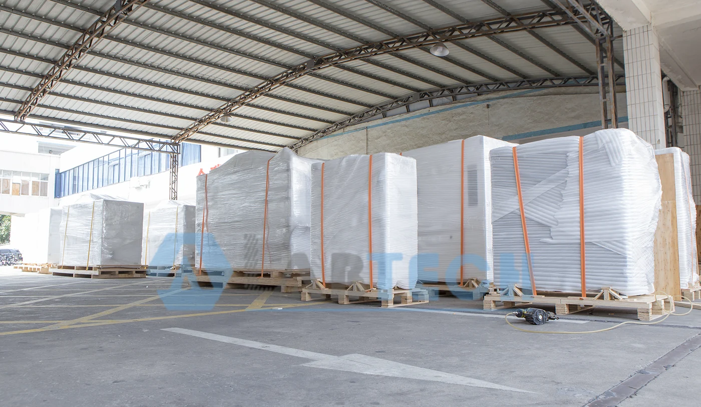 Wrapped testing equipment secured with straps on wooden pallets at LABTECH