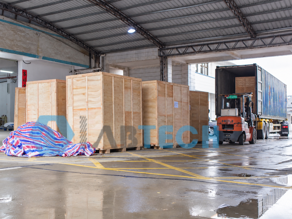 Wooden equipment crates and forklift beside a shipping container at LABTECH